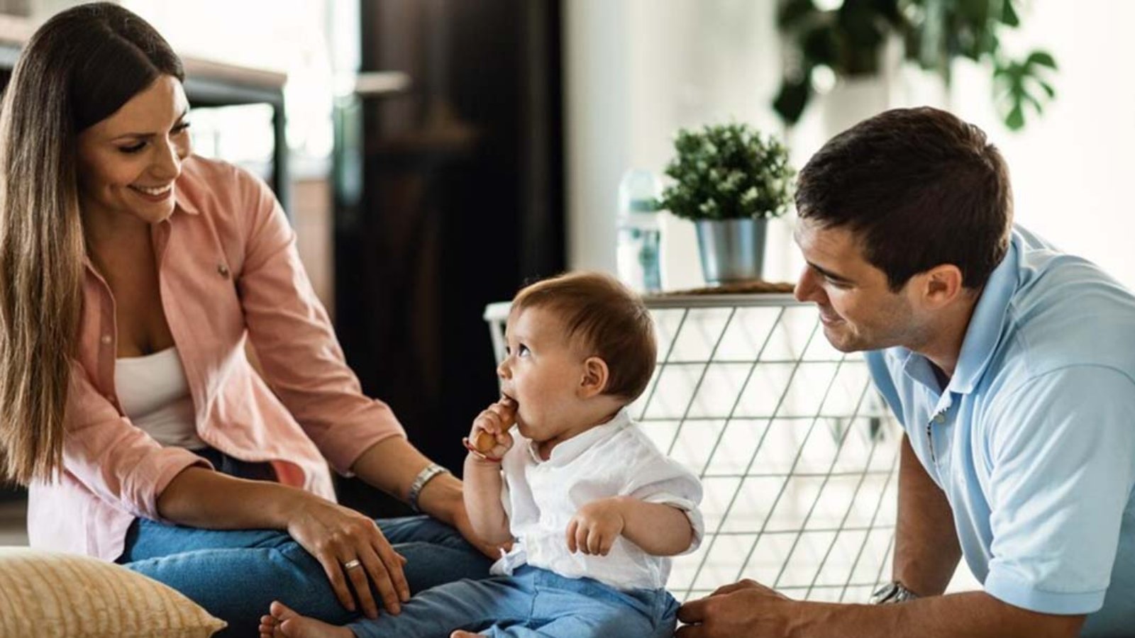 happy-parents-their-small-son-enjoying-family-time-their-home_637285-1756
