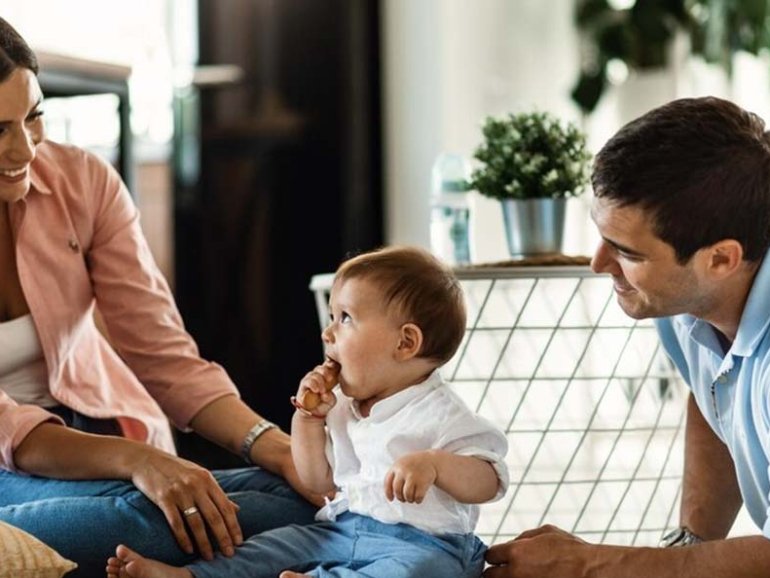 happy-parents-their-small-son-enjoying-family-time-their-home_637285-1756