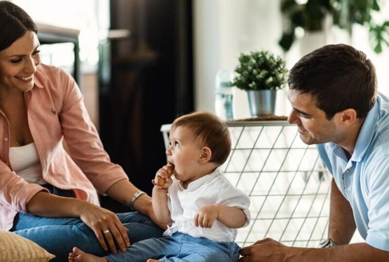 happy-parents-their-small-son-enjoying-family-time-their-home_637285-1756