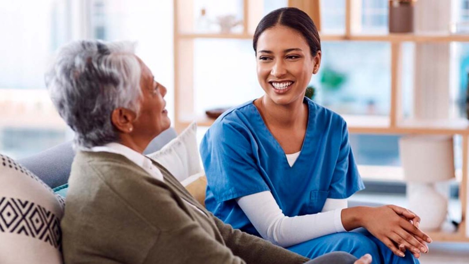 healthcare-happy-nurse-talking-old-woman-nursing-home-during-visit-checkup-medical-smile-female-medicine-professional-having-conversation-with-senior-resident_590464-191695