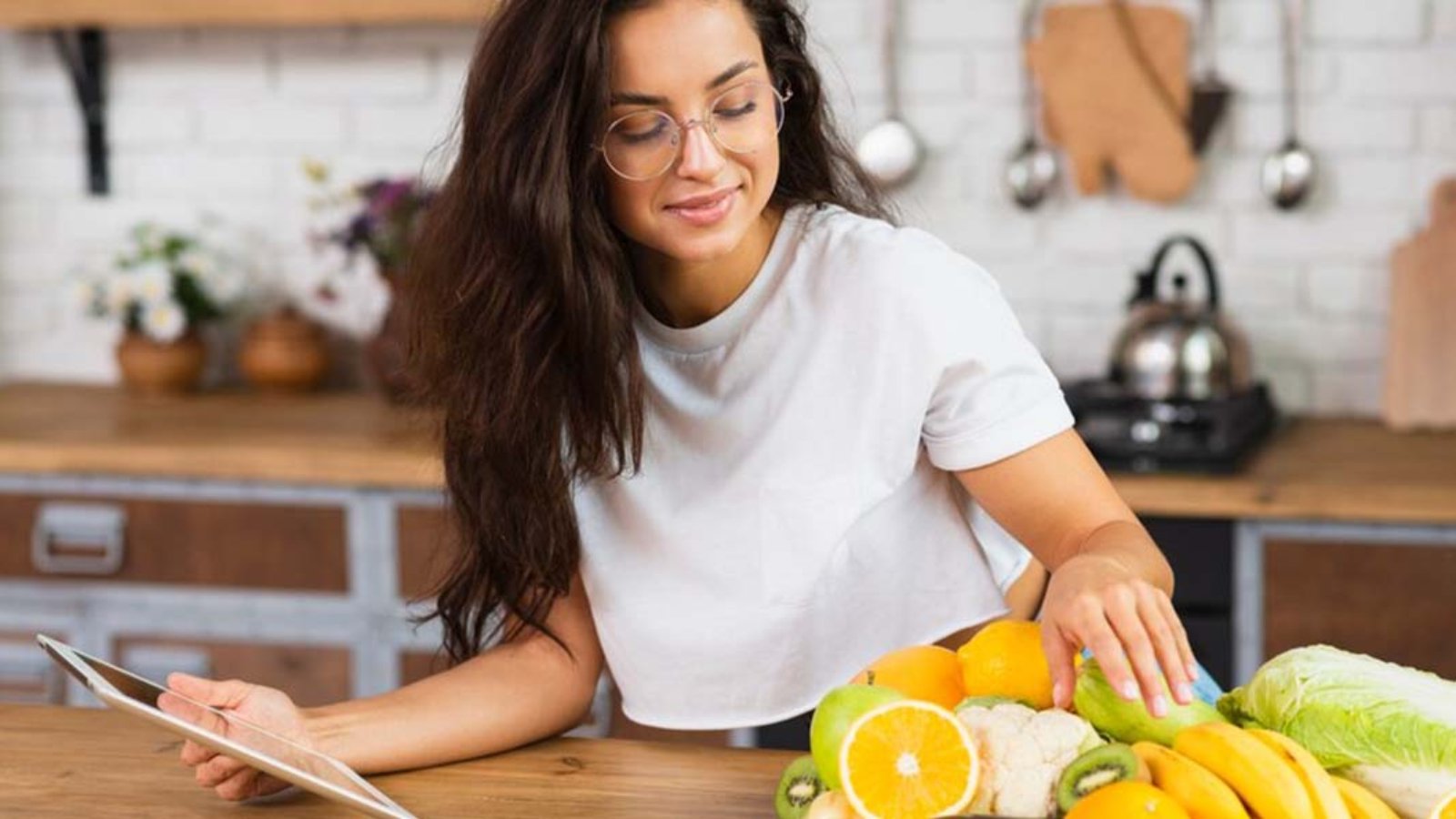 medium-shot-woman-with-fruits-tablet_23-2148302150